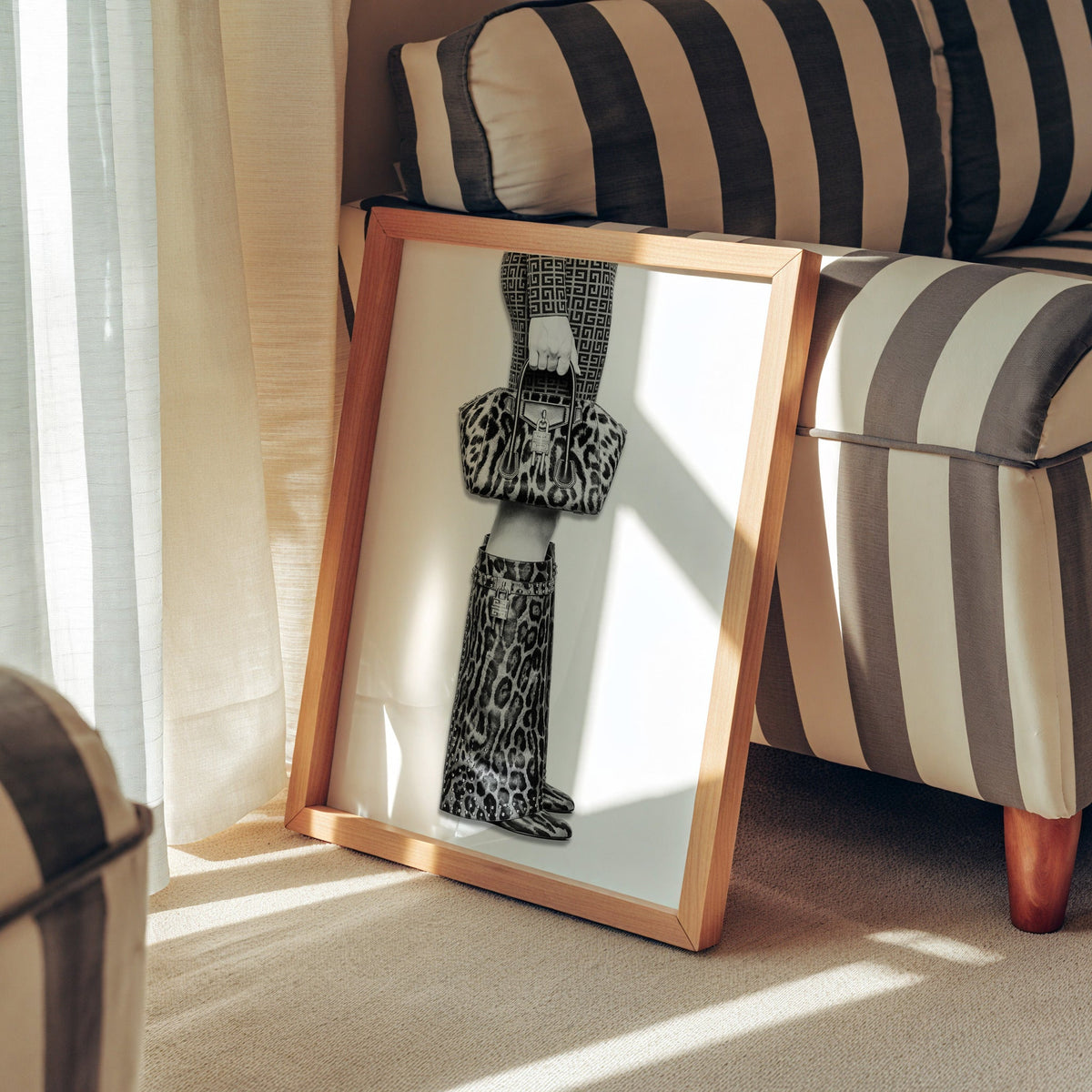 Leopard handbag and knee boots fashion photo print in a pine frame leaning against a striped armchair