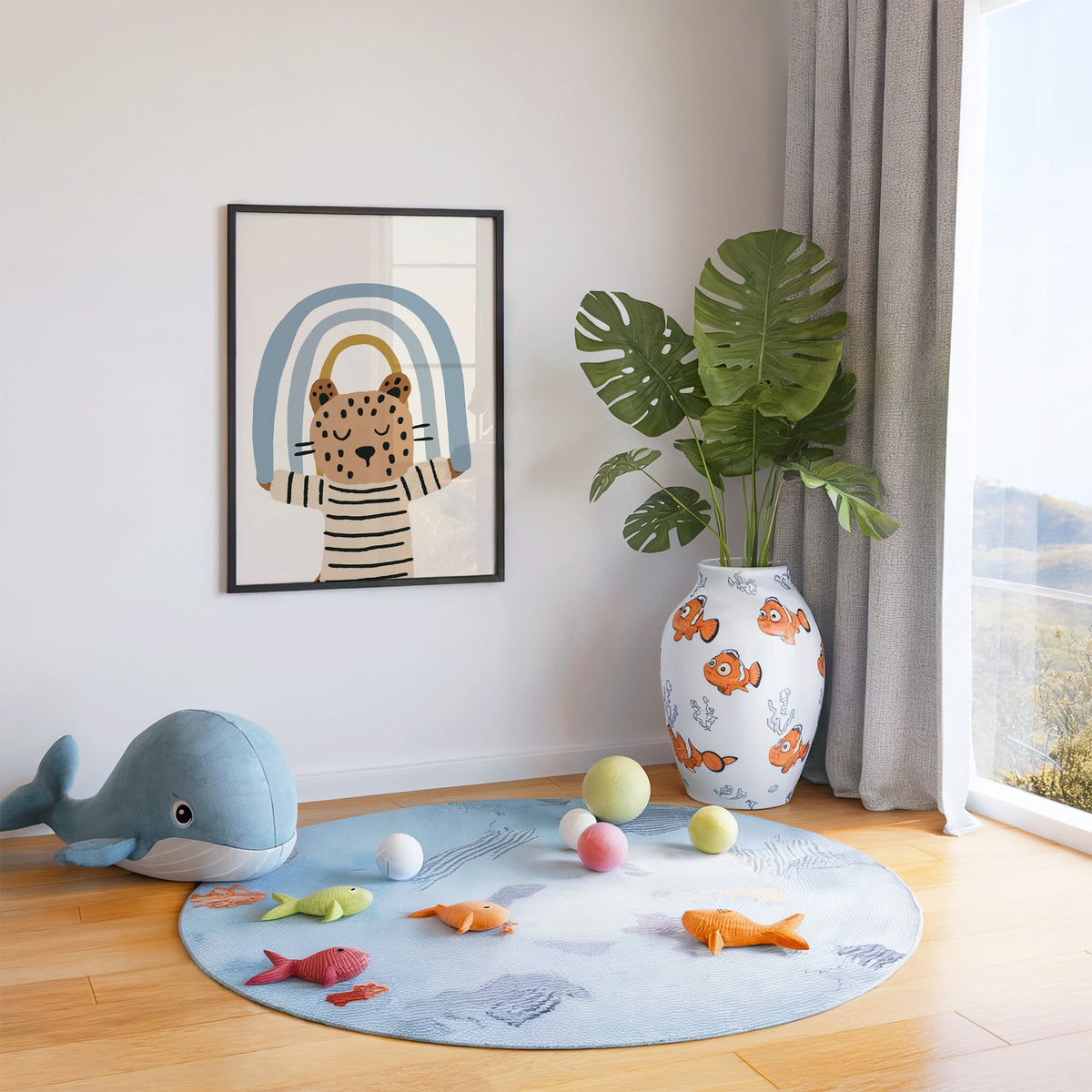 Leopard holding blue rainbow nursery print in a black frame in a playroom with an ocean rug and whale plush