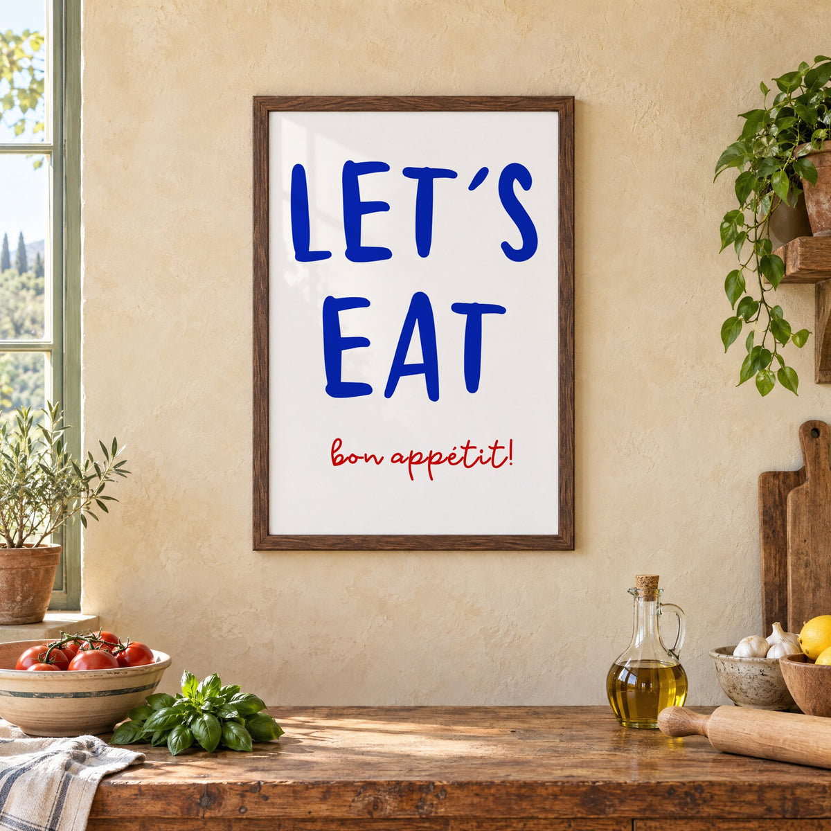 Let's Eat cobalt blue type print in a walnut frame above a rustic Italian kitchen table with tomatoes