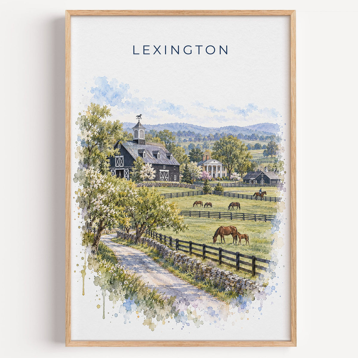 Lexington, Kentucky watercolor print in a light oak frame on a plain white wall