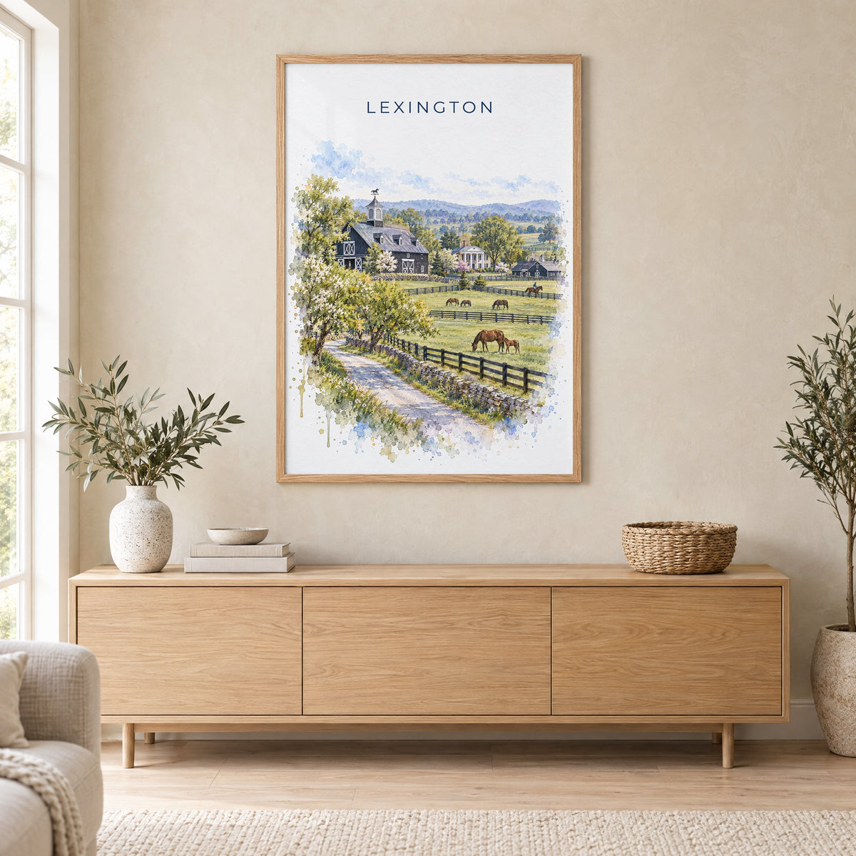 Lexington, Kentucky watercolor print in an oak frame above a light wood sideboard in a Scandinavian living room