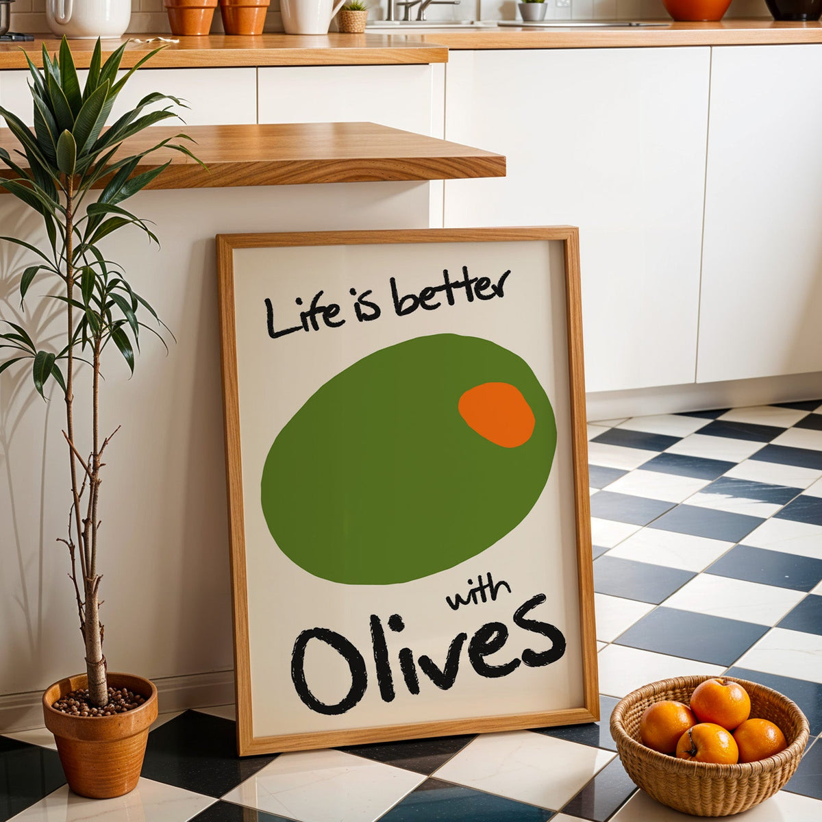 Life is better with olives print in an oak frame by a kitchen island and checkered floor