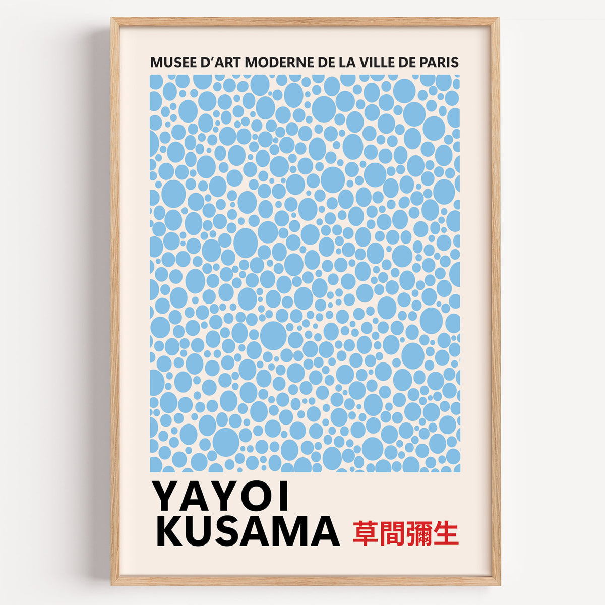 Yayoi Kusama inspired light blue polka dot print in a wood frame on a plain wall