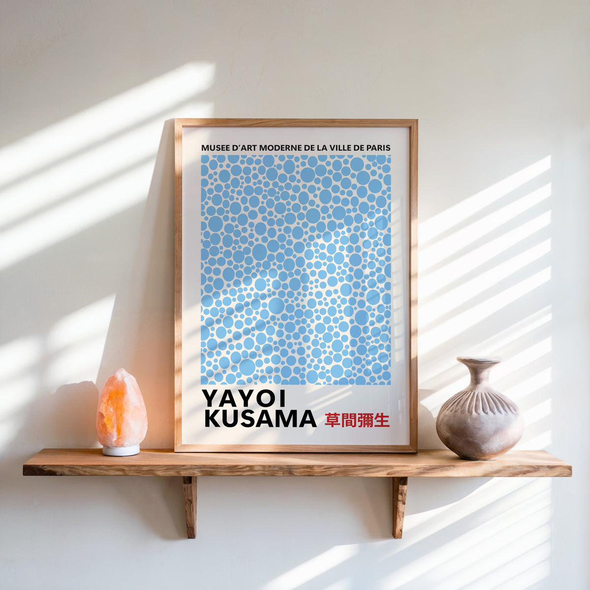 Yayoi Kusama inspired light blue polka dot print above a shelf with a salt lamp
