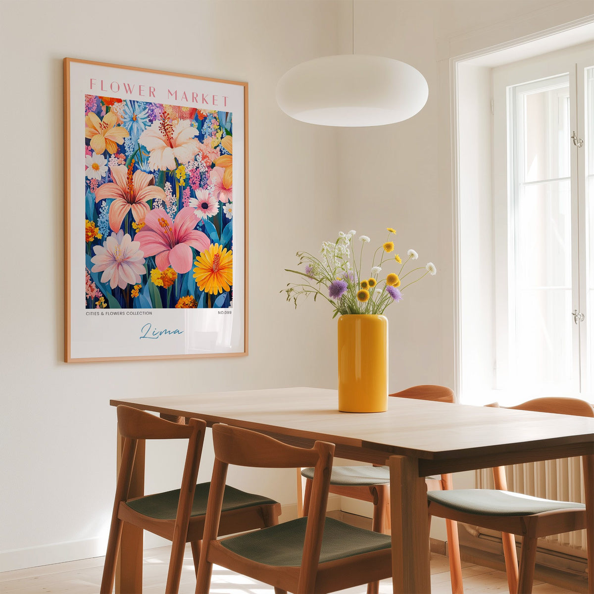 Lima flower market print in an oak frame above a dining table with a yellow vase and white pendant light