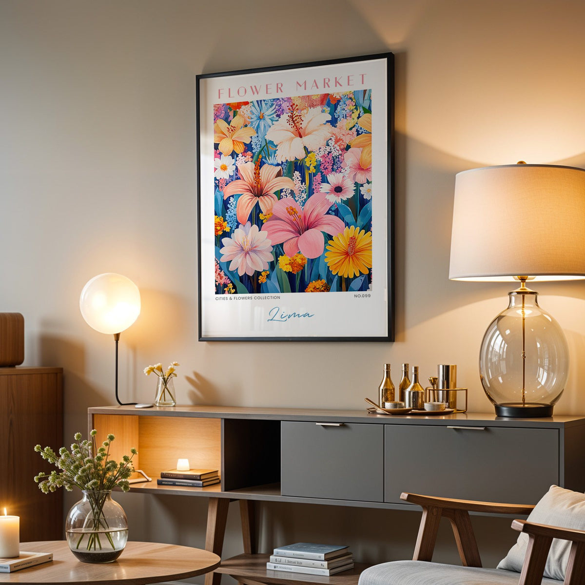 Lima flower market print in a black frame above a grey media console with a glass table lamp