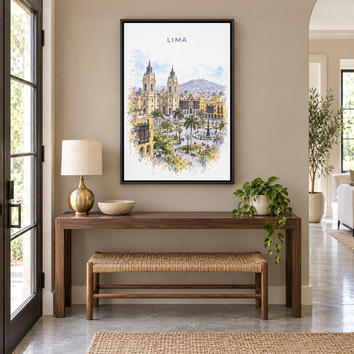 Lima, Peru watercolor print as a black floater canvas above a walnut console and woven bench in an entryway