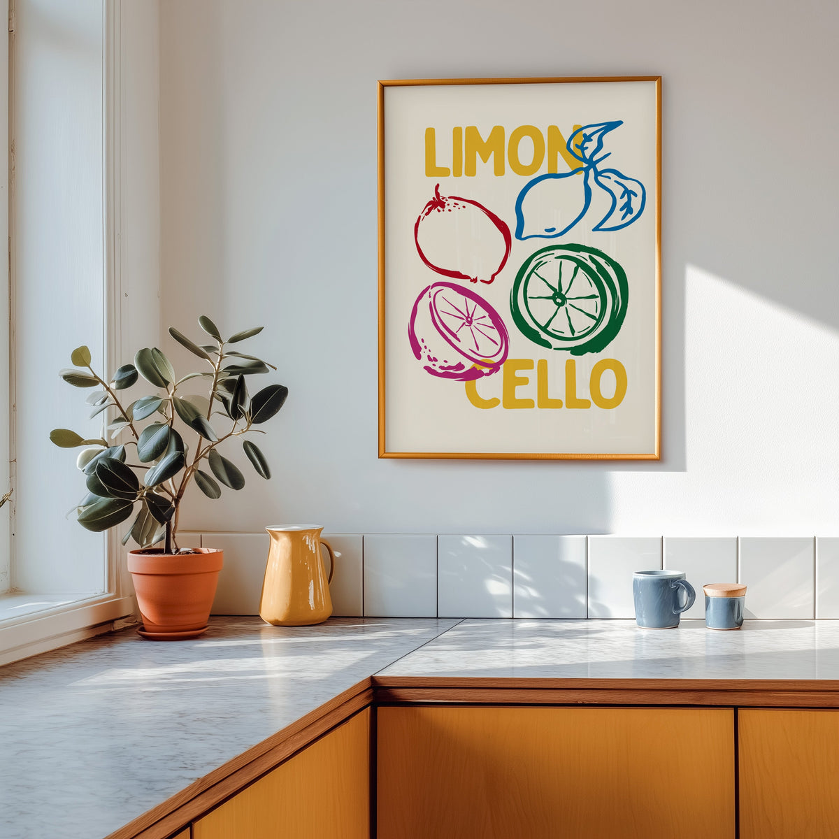 Limoncello lemon sketch print shown in a gold frame above a marble counter with a yellow ceramic jug