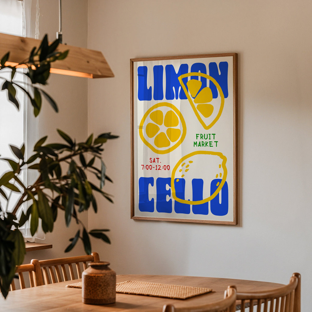 Limoncello lemon print in a walnut frame above a dining table beside an olive tree