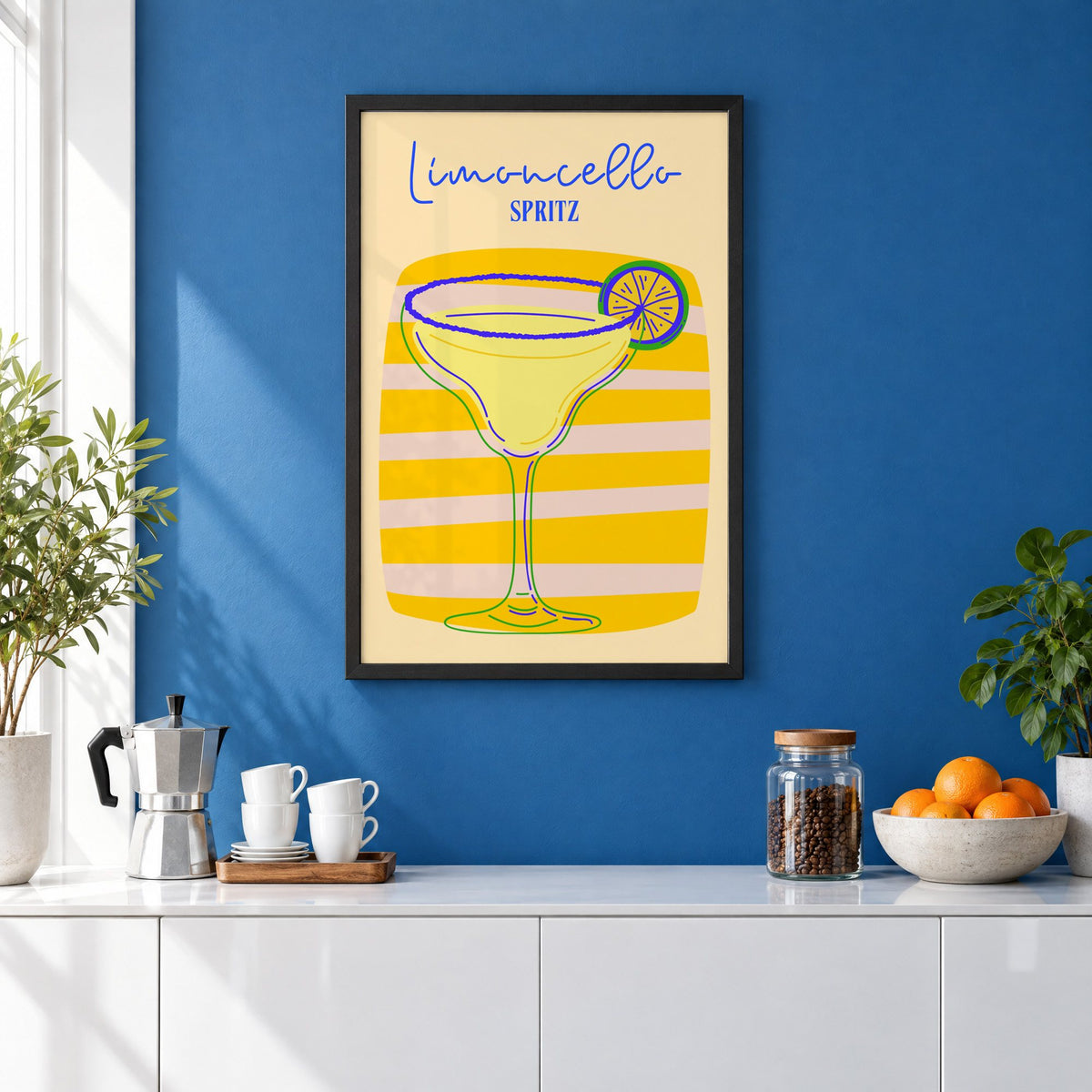 Limoncello Spritz yellow stripe print in a black frame on a cobalt blue wall above a coffee station