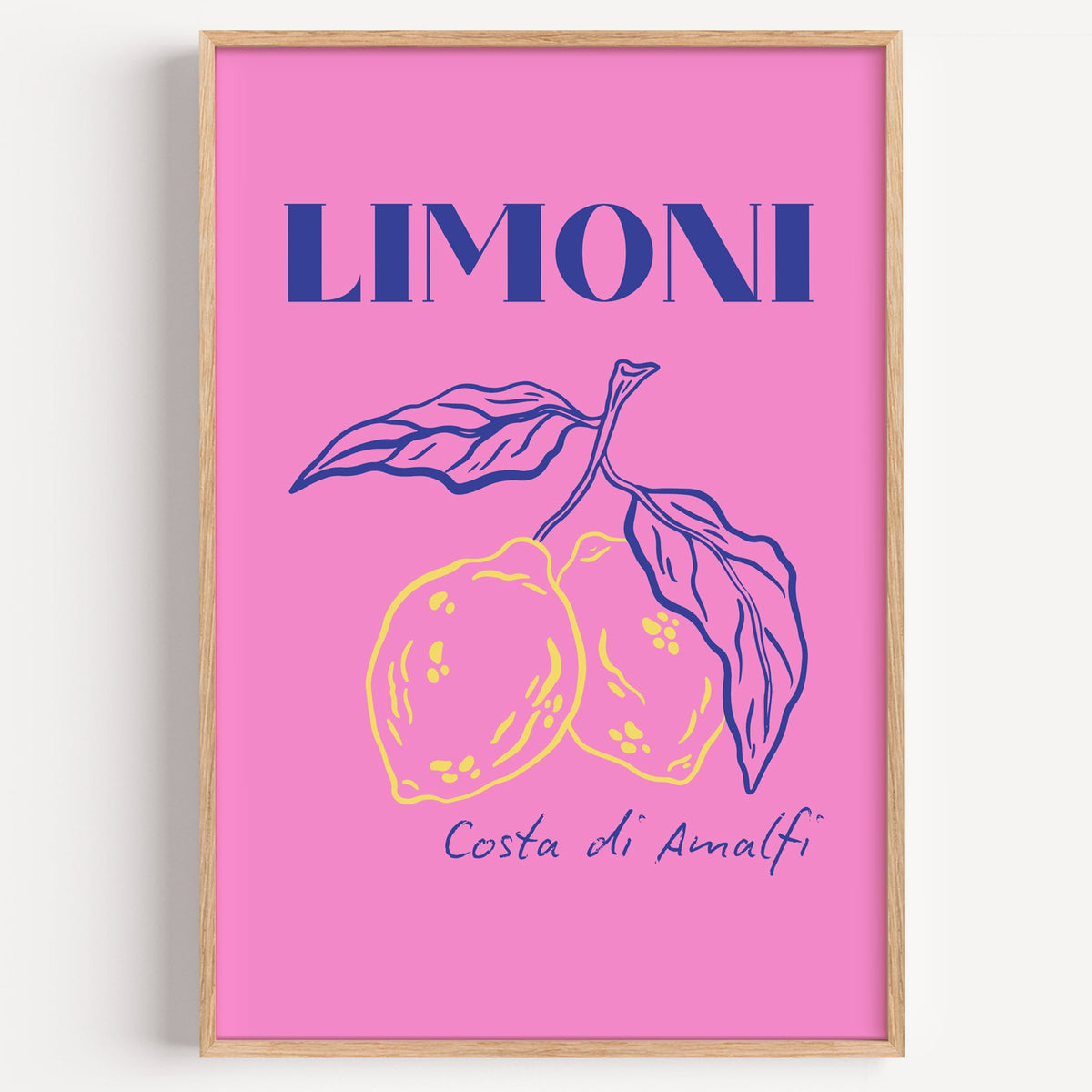 LIMONI Costa di Amalfi lemon branch print in a light oak frame on a plain white wall
