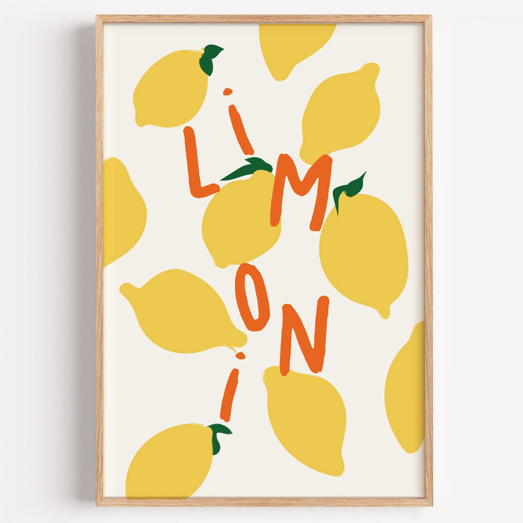 Limoni lemon pattern print in a light oak frame on a plain white wall