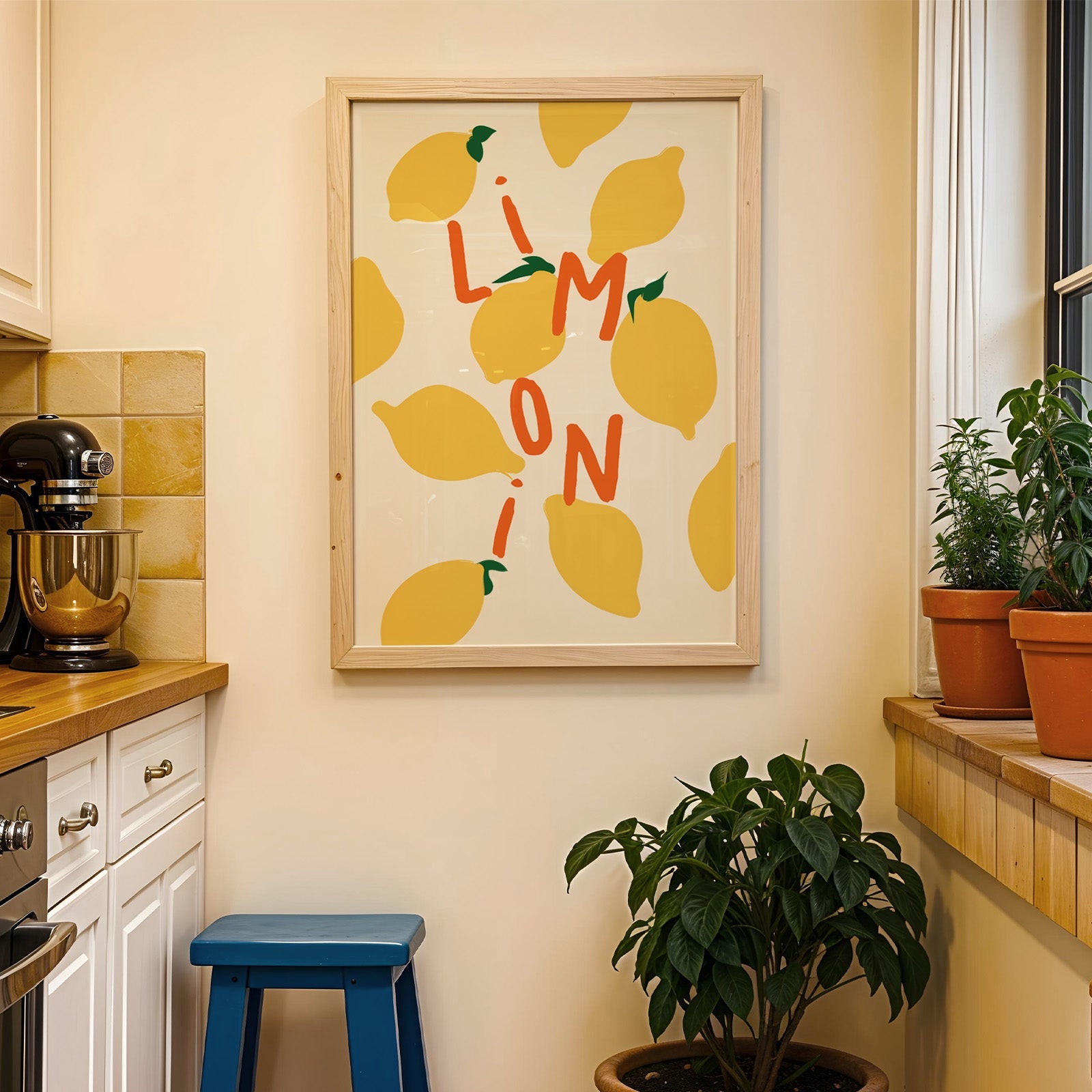 Limoni lemon pattern print in a wood frame on a yellow tiled kitchen wall