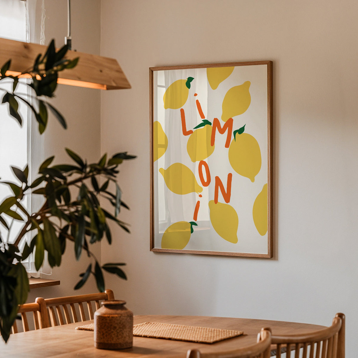 Limoni lemon pattern print in a walnut frame above a dining table beside an olive tree