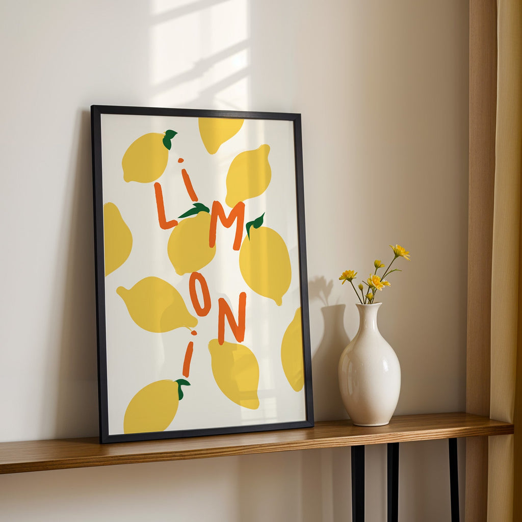 Limoni lemon pattern print in a black frame on a console table with yellow daisies