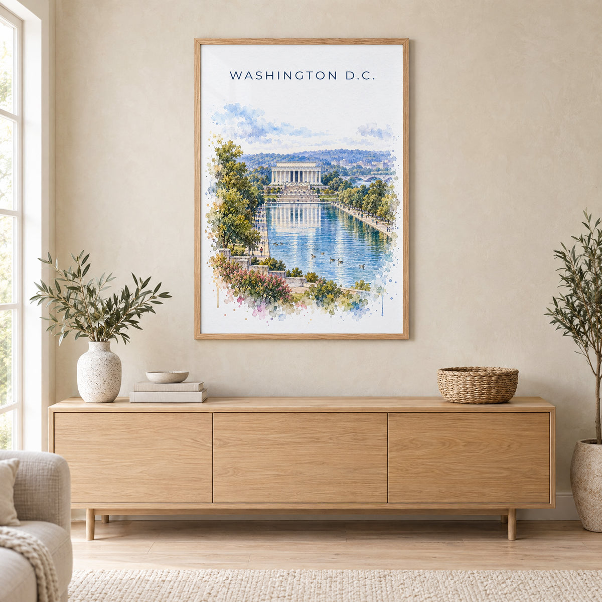 Lincoln Memorial watercolor print in an oak frame above a light wood sideboard in a Scandinavian living room