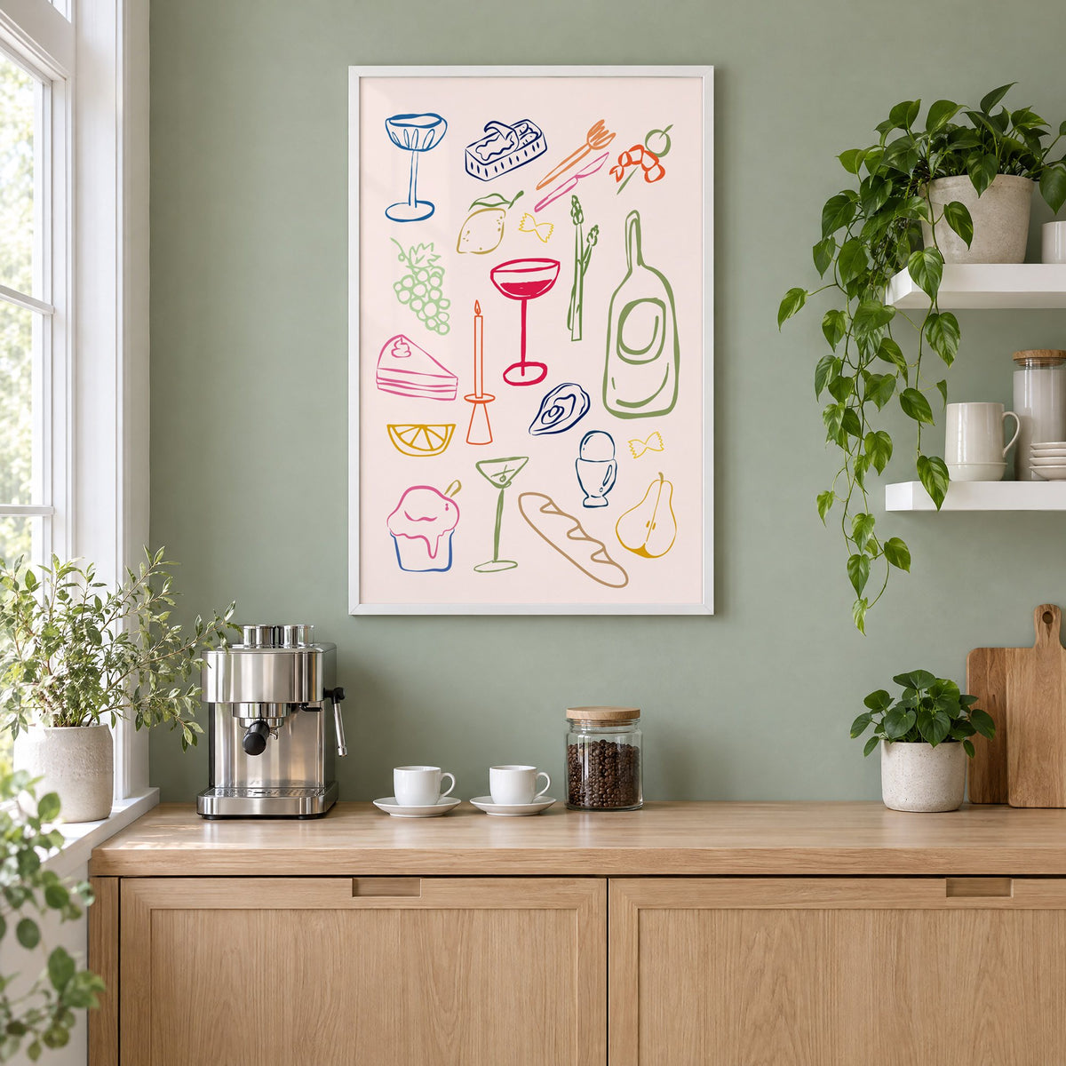 Line art candle coupe dinner party print in a white frame on a sage green coffee nook wall above an espresso machine