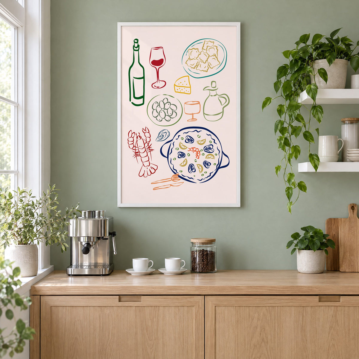 Line art paella wine olives print in a white frame on a sage green coffee nook wall above an espresso machine