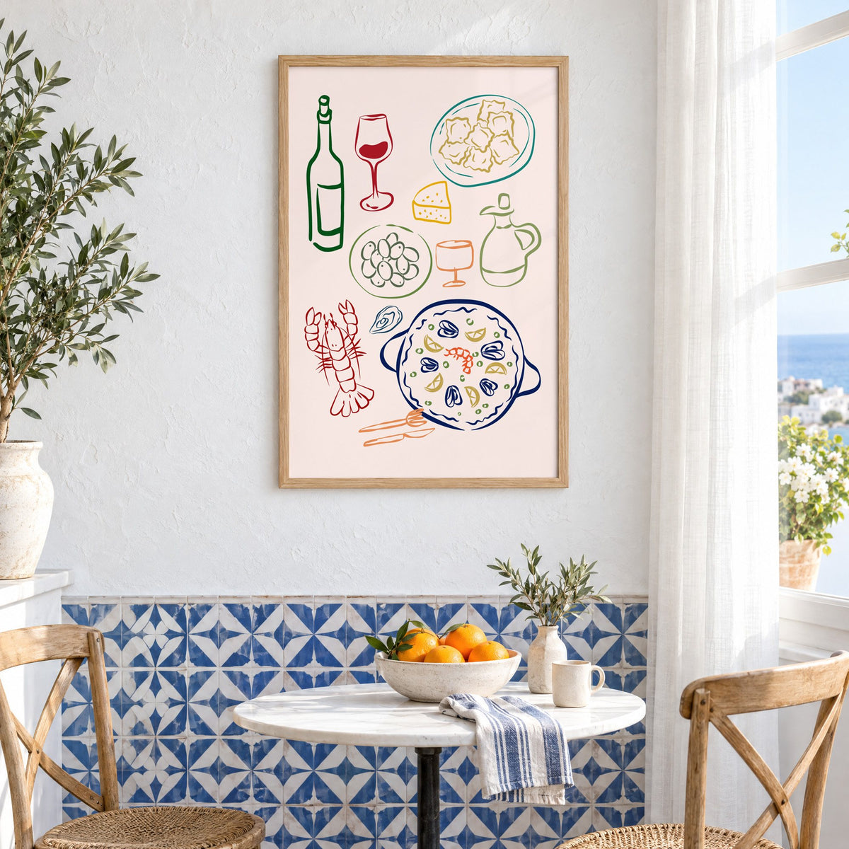 Line art paella wine olives print in an oak frame above a bistro table and blue patterned tiles
