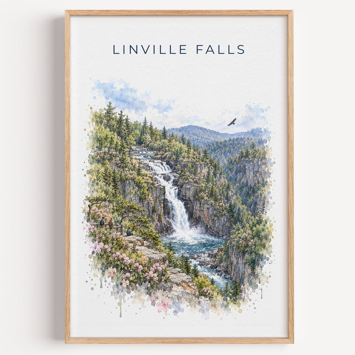 Linville Falls watercolor print in a light oak frame on a plain white wall