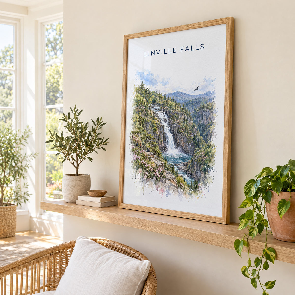 Linville Falls watercolor print in an oak frame on a picture ledge in a sunlit sunroom