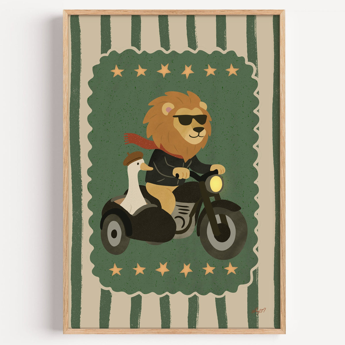 Lion on motorcycle with goose sidecar nursery print in a light oak frame on a plain white wall