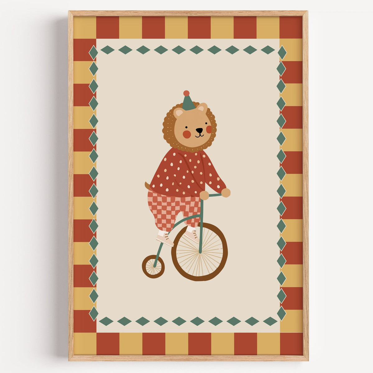 Lion penny-farthing circus nursery print in a light oak frame on a plain white wall