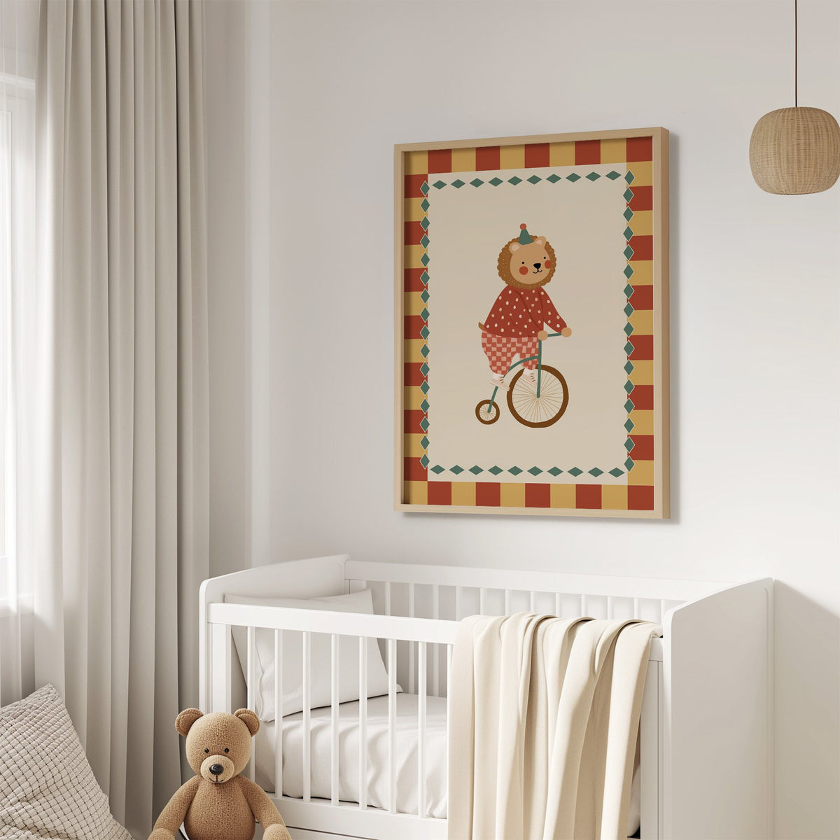 Lion penny-farthing circus nursery print in an oak frame above a white crib with a teddy bear