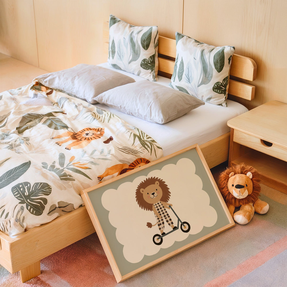 Landscape lion on scooter gingham nursery print in an oak frame leaning on a kids bed by a lion plush