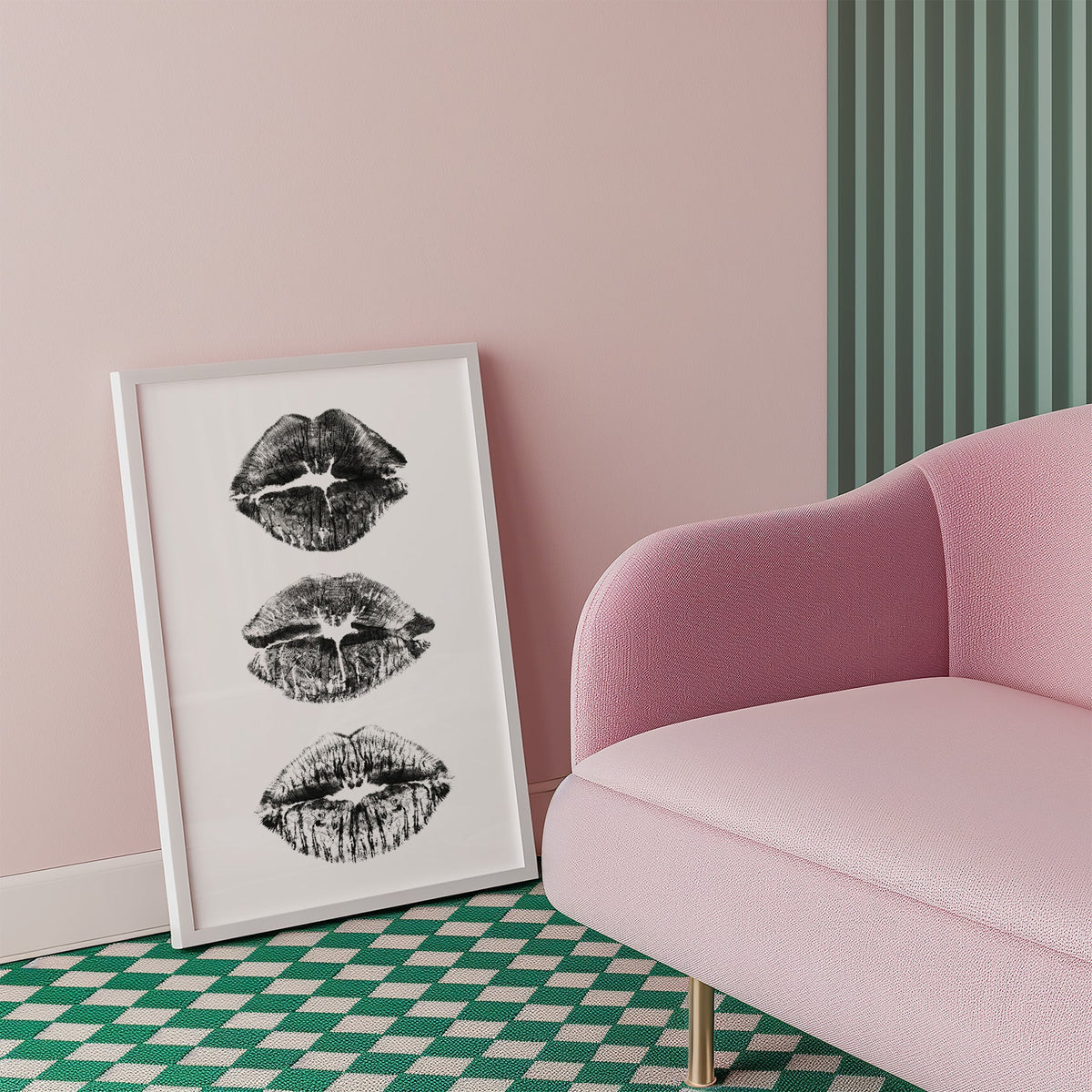 Three lipstick kiss marks stacked print in a white frame beside a pink armchair on a checkered floor