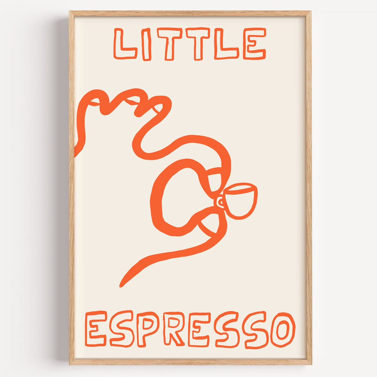 Little espresso one line print in a light oak frame on a plain white wall