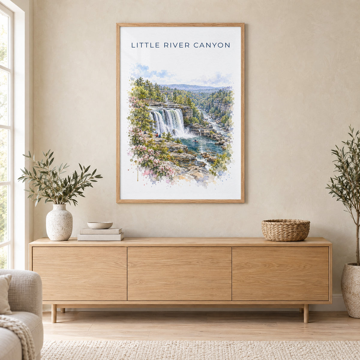 Little River Canyon National Preserve watercolor in an oak frame above a light wood sideboard in a Scandinavian living room