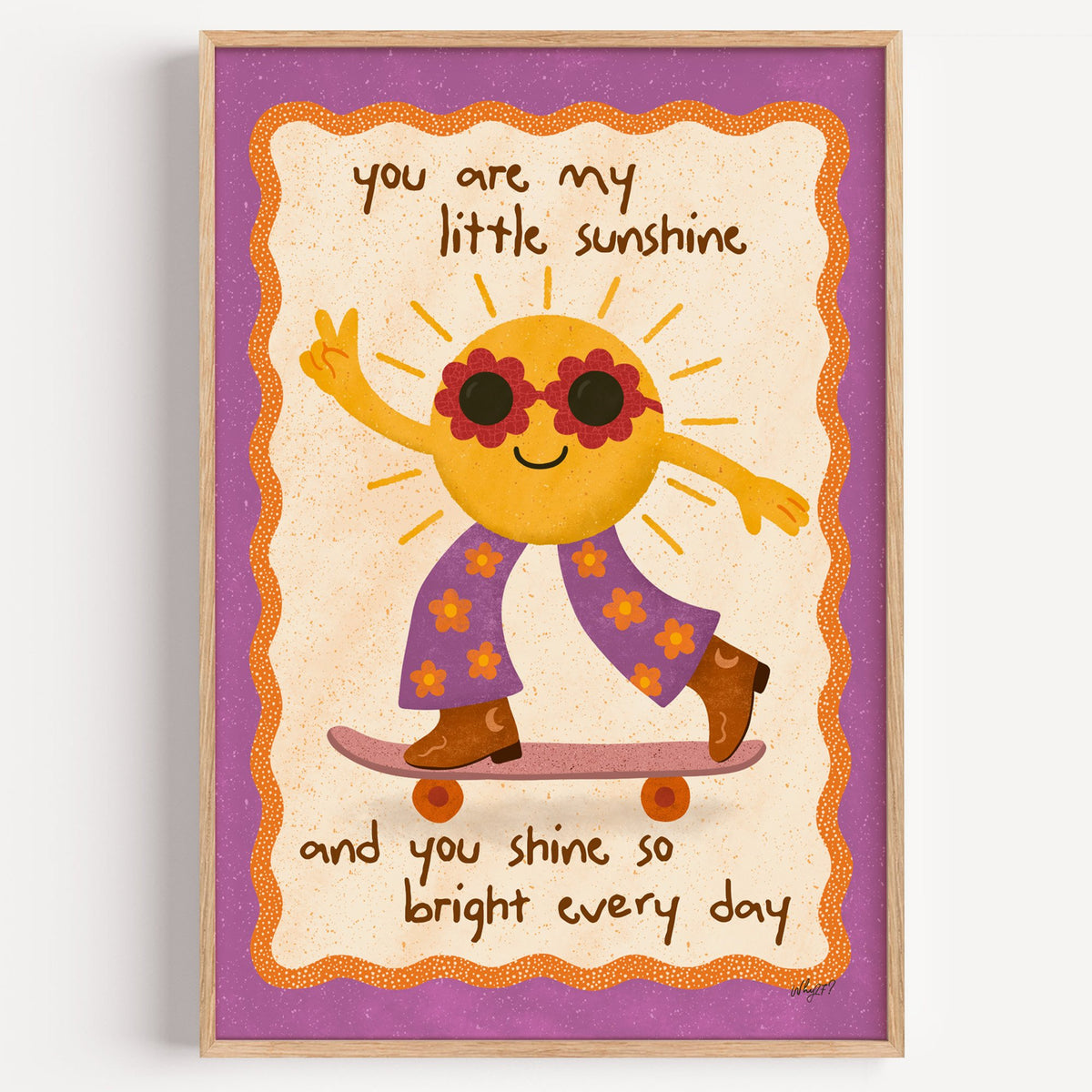 Skateboarding sun little sunshine nursery print in a light oak frame on a plain white wall