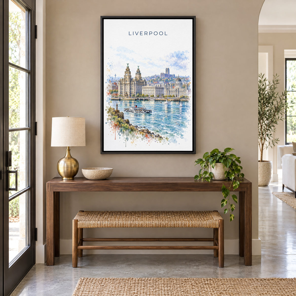 Liverpool watercolor print as a black floater canvas above a walnut console and woven bench in an entryway