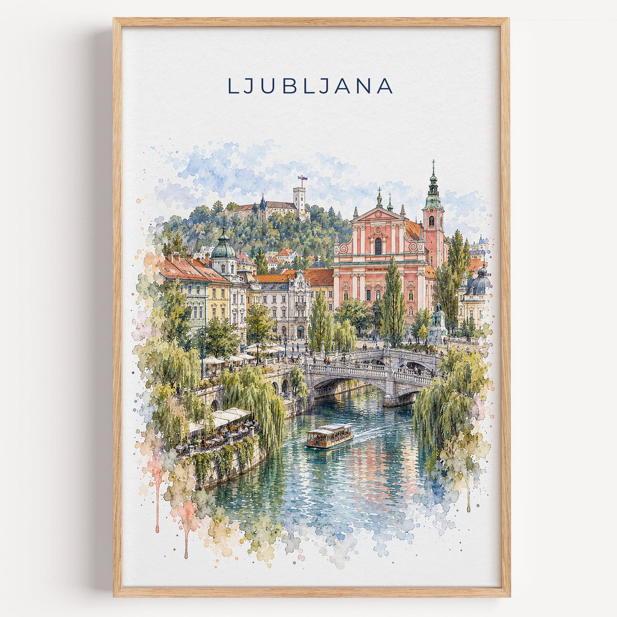 Ljubljana watercolor print in a light oak frame on a plain white wall