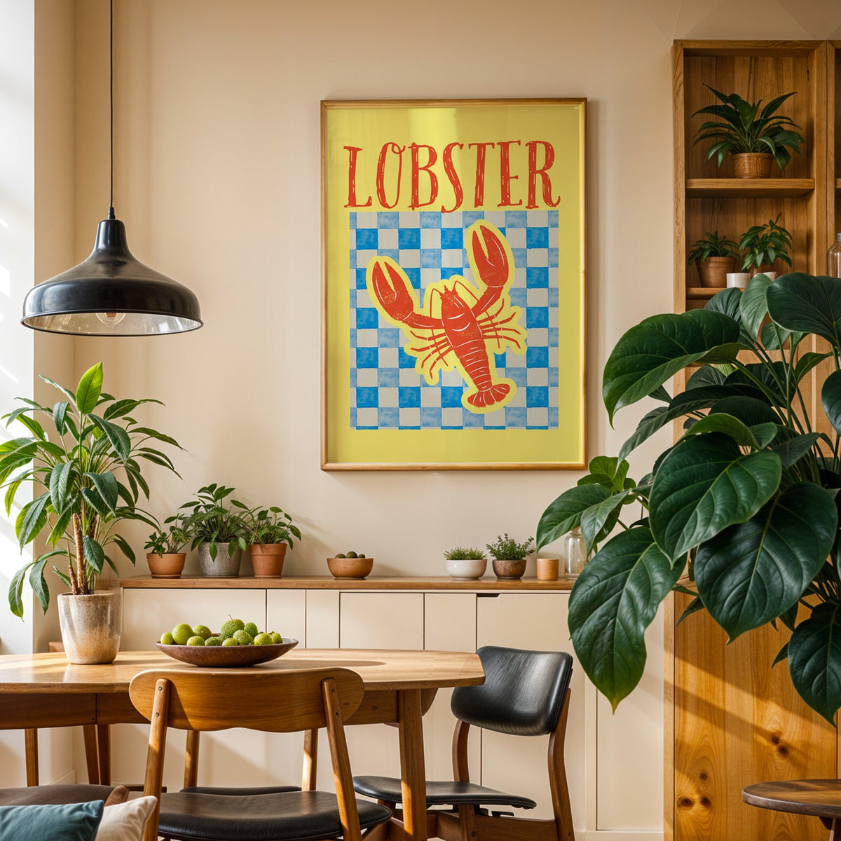 Lobster blue check print in an oak frame in a dining room above a plant-lined sideboard
