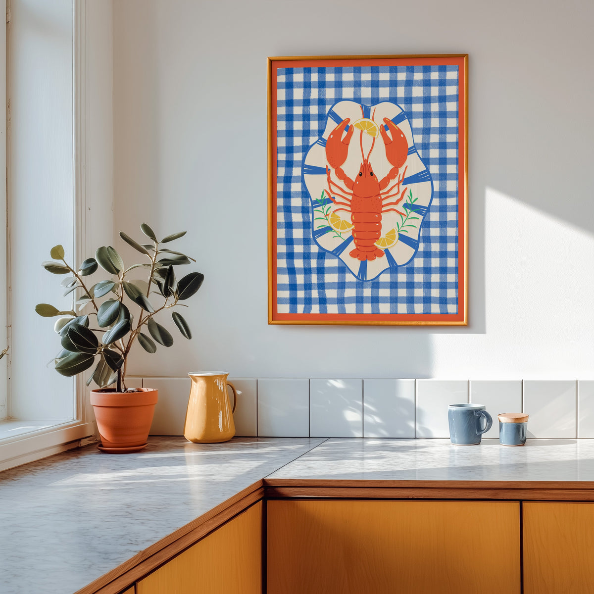 Lobster gingham print shown in a gold frame above a marble counter with a yellow ceramic jug
