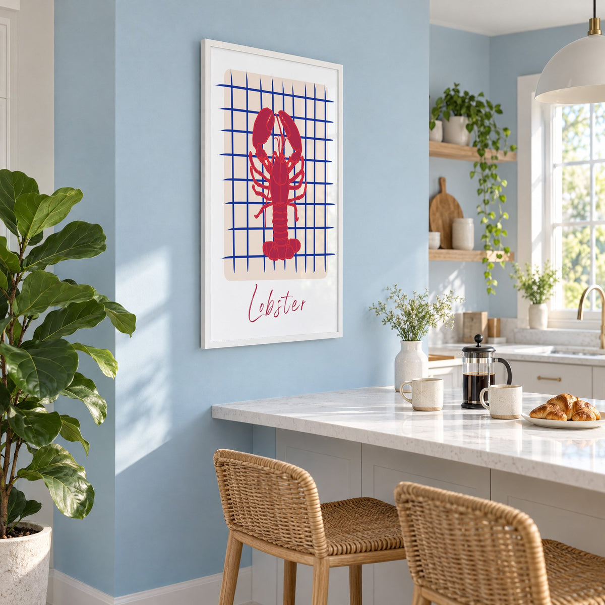 Lobster on cobalt grid print in a white frame on a pale blue wall above a breakfast bar with rattan stools