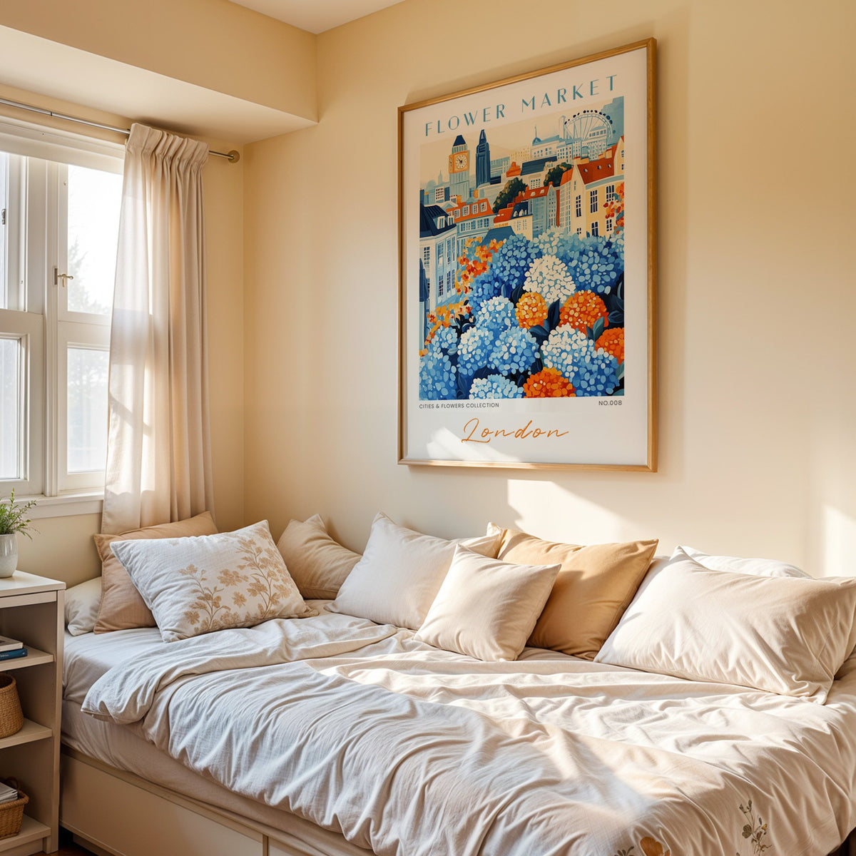 London flower market print in an oak frame above a cream daybed in a sunny bedroom