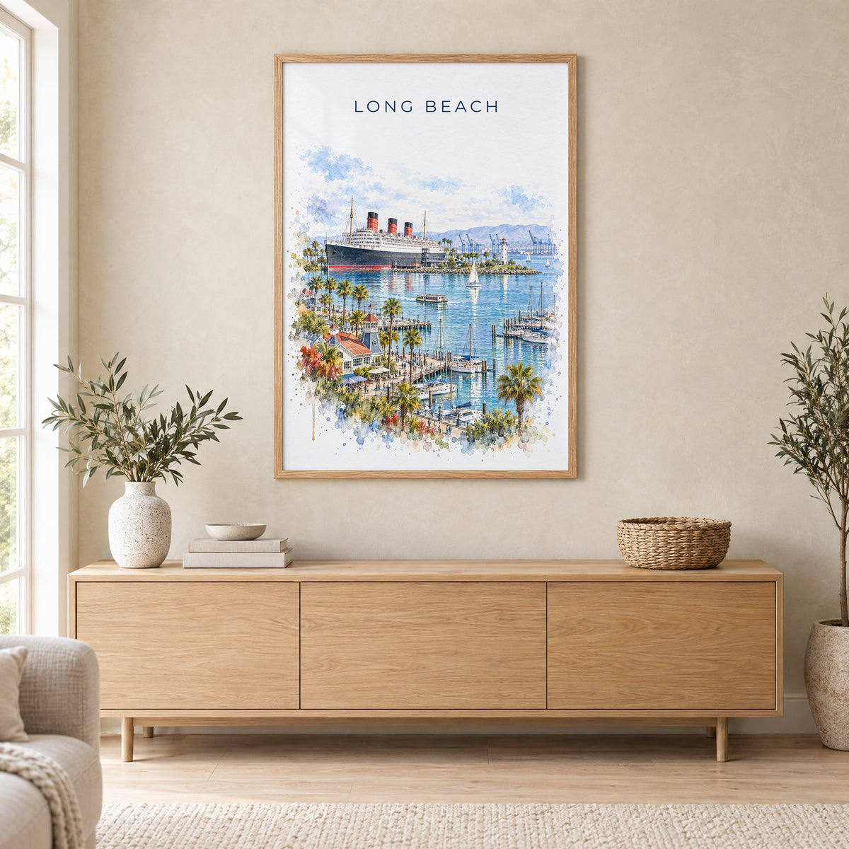 Long Beach watercolor print in an oak frame above a light wood sideboard in a Scandinavian living room