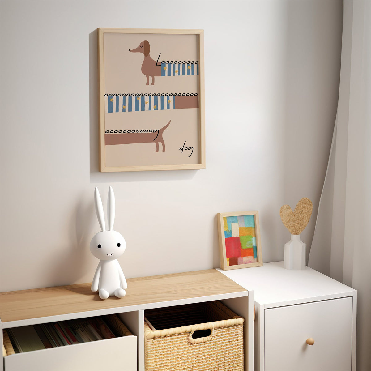 Long dog dachshund sweater nursery print in an oak frame above a kids cubby shelf with a woven basket and bunny lamp