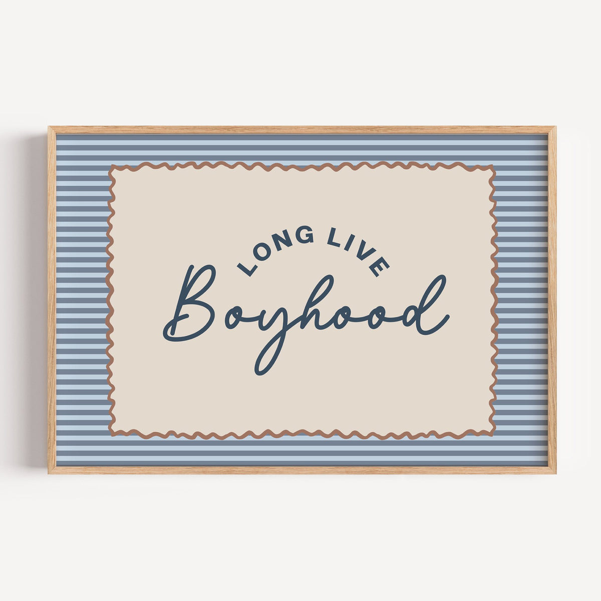 Landscape long live boyhood nursery print in a light oak frame on a plain white wall