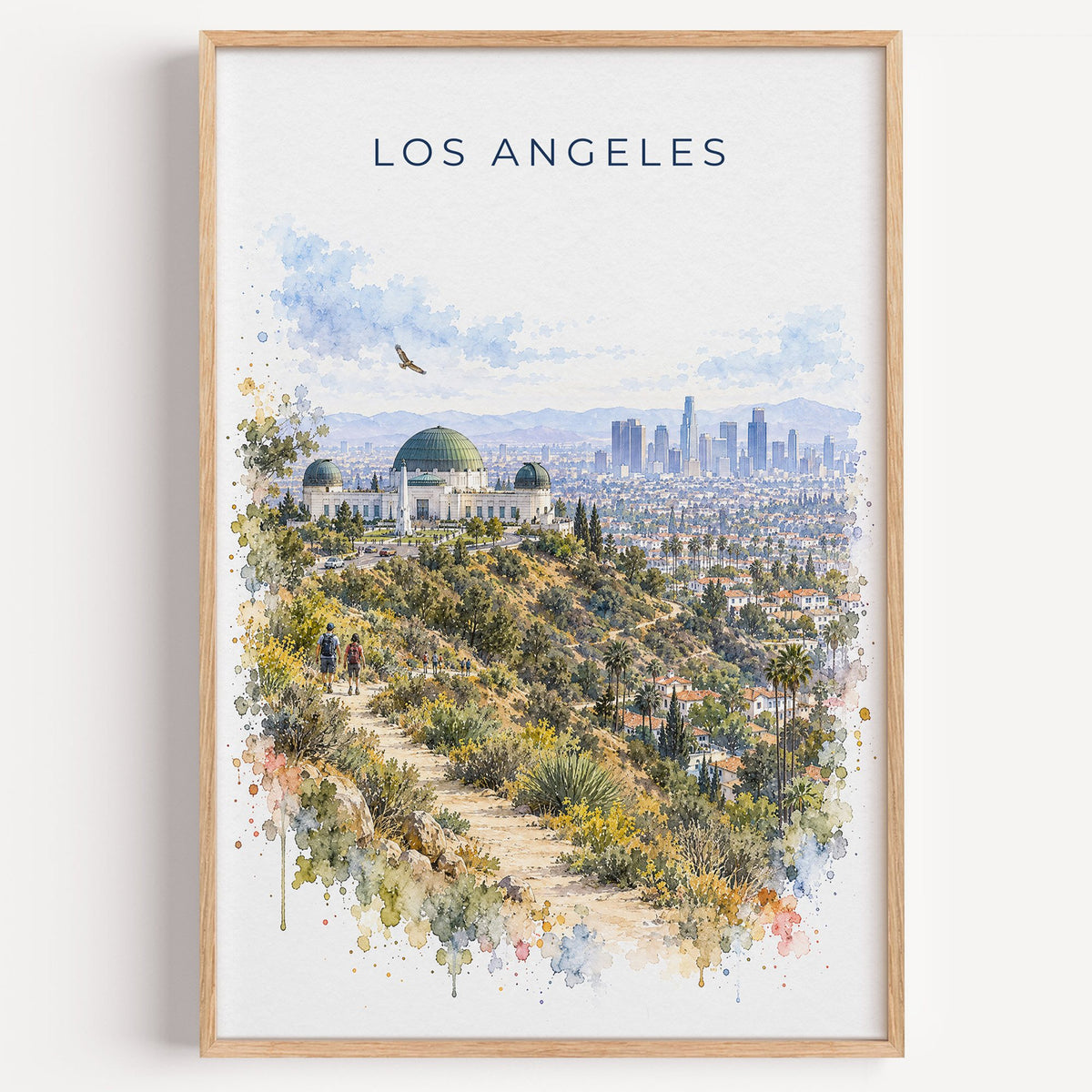 Los Angeles watercolor print in a light oak frame on a plain white wall