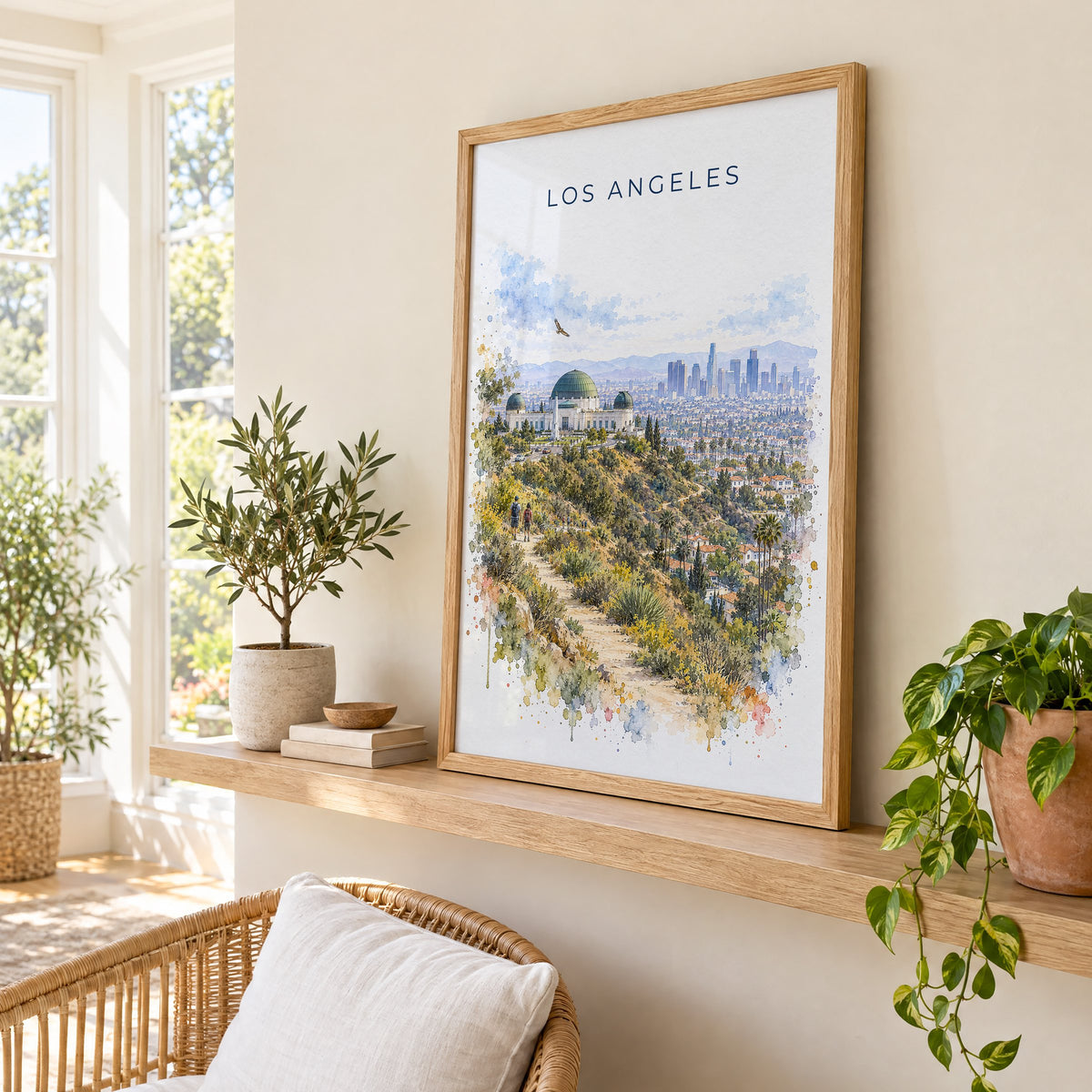 Los Angeles watercolor print in an oak frame on a picture ledge in a sunlit sunroom