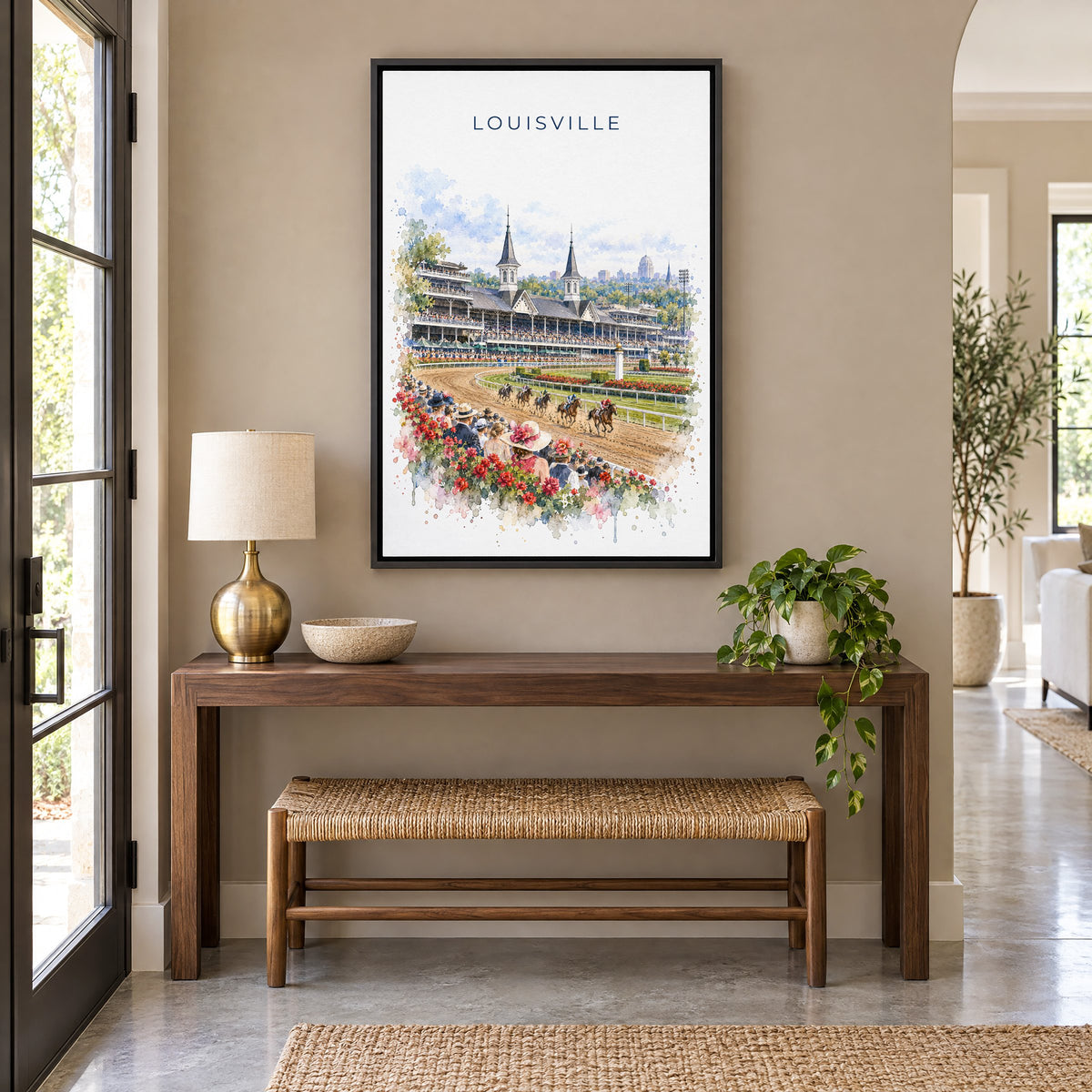 Louisville watercolor print as a black floater canvas above a walnut console and woven bench in an entryway