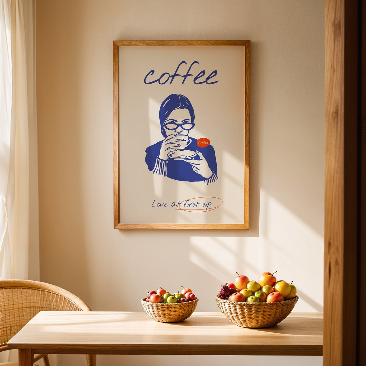 Coffee portrait print in an oak frame hung above a dining table with wicker bowls of fruit