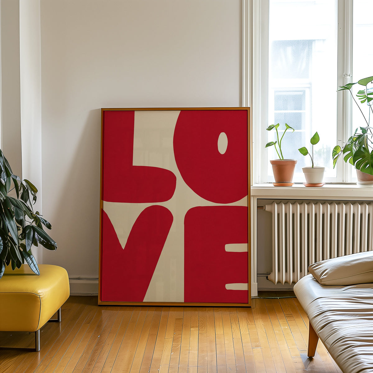 Bold red letters print in an oak frame leaning beside a yellow leather bench