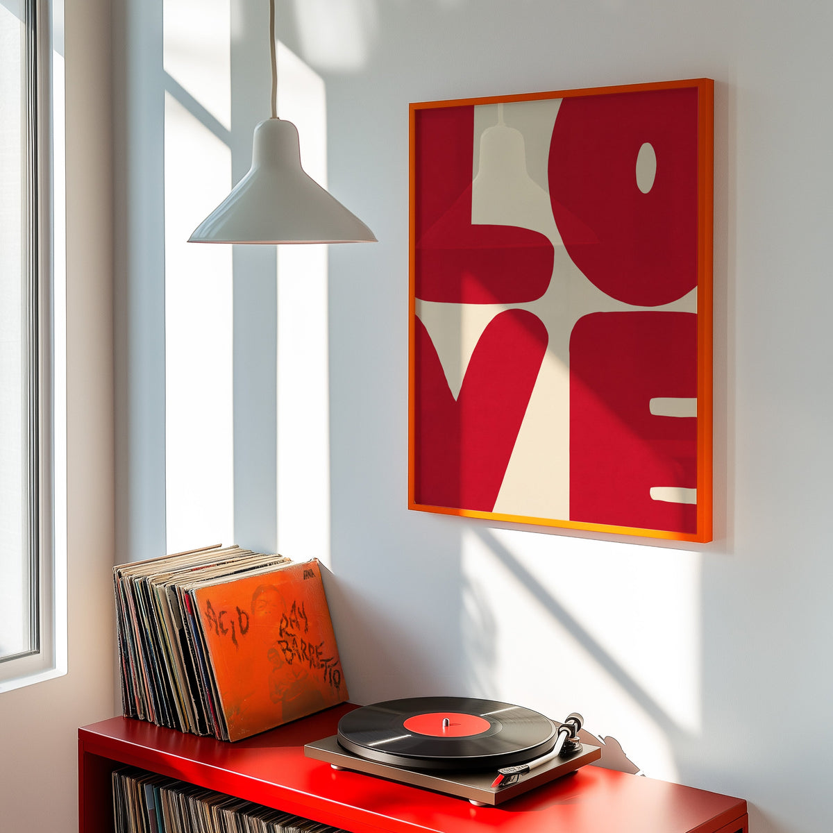 Pop art LOVE print shown in an orange frame above a red record cabinet and turntable