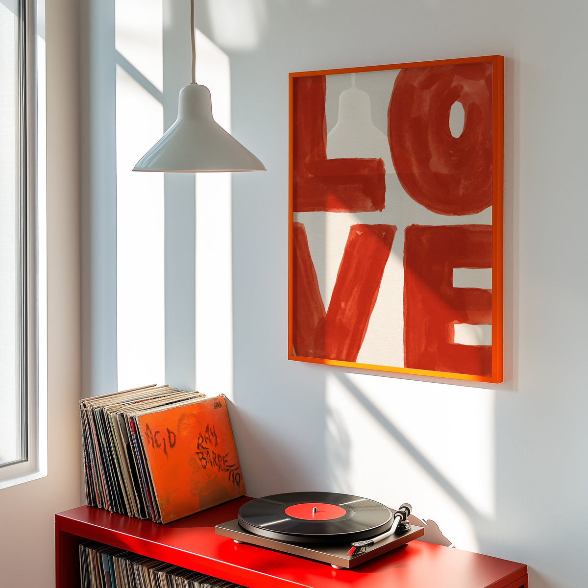 Hand-painted LOVE print shown in an orange frame above a red record cabinet and turntable