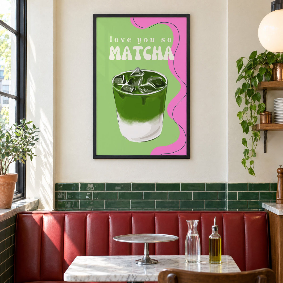 Love you so MATCHA iced latte print in a black frame above a red leather booth in a sunny pizzeria